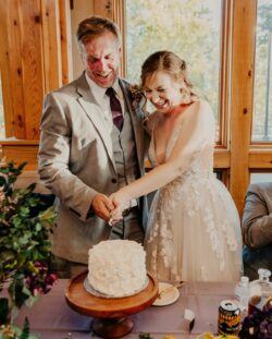 Fairy lights and lavender floral decor at fall wedding at Prairie Oak Lodge Marion Iowa