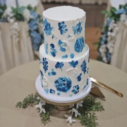 Wedding celebration at the storybook Amana Colonies venue in Iowa with blue decor