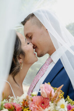 Fun and carefree wedding reception at Bella Sala in Tiffin Iowa with wildflower centerpieces