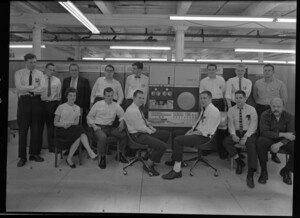 Gordon Bell, Alan Kotok, and others posing around a PDP-6