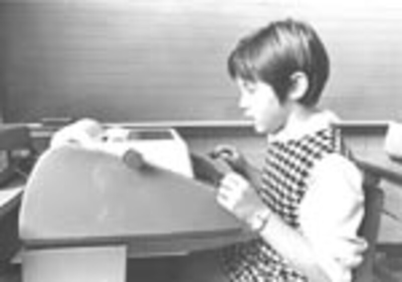 Timesharing student using teletype machine - Image 1