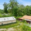 20.42 ACRES with NICE HOME, BARNS & POLE BARN HOME