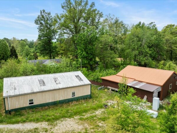 20.42 ACRES with NICE HOME, BARNS & POLE BARN HOME