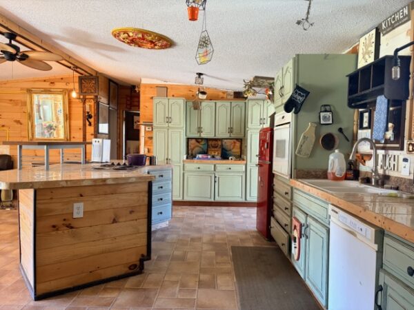 20.42 ACRES with NICE HOME, BARNS & POLE BARN HOME