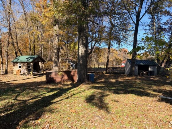 20.42 ACRES with NICE HOME, BARNS & POLE BARN HOME