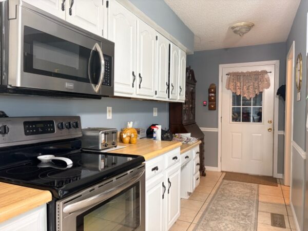 BEAUTIFUL BRICK HOME ON .81+/- ACRE LOT