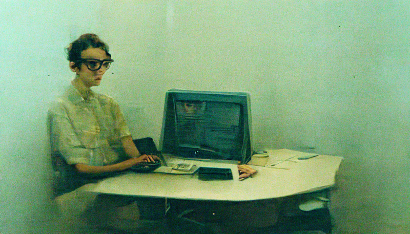 intern young person clueless dumb passive terry richardson real warm natural light office computer doesn't know what to do
