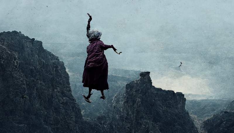 old woman wearing cardigan jumping off cliff mountains in distances dark below