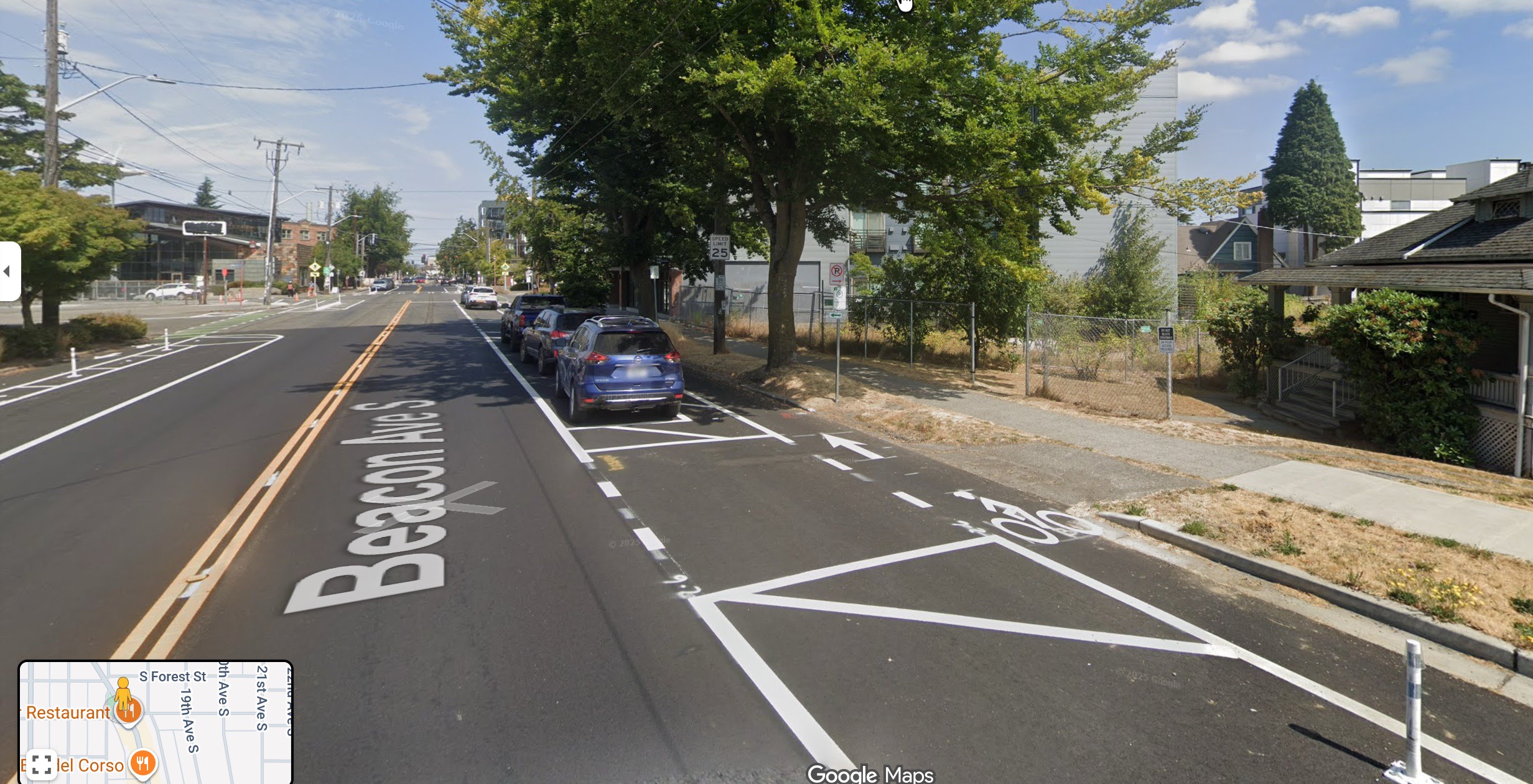 Protected bike lane with parked car buffer along Beacon Ave S