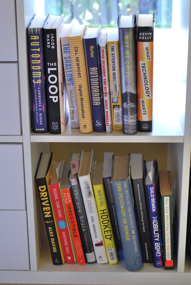 Queuing up books to read (bottom shelf)