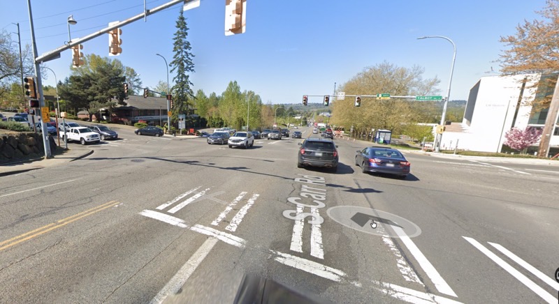 Dense traffic intersection with no bike lanes along S Carr Rd