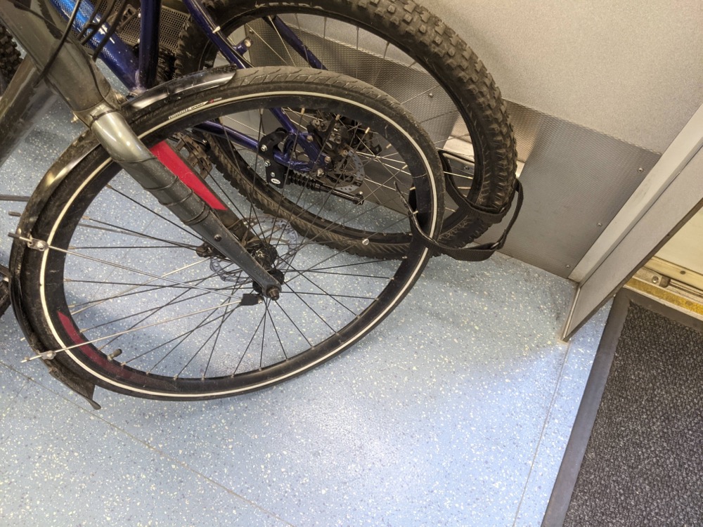 Securing your bike on the Sounder with flimsy velcro straps.