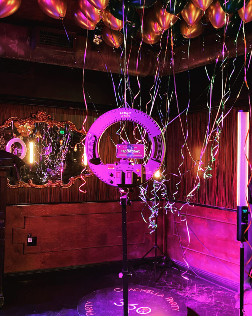 The Coachella Party 360 photo booth surrounded by balloons at an event