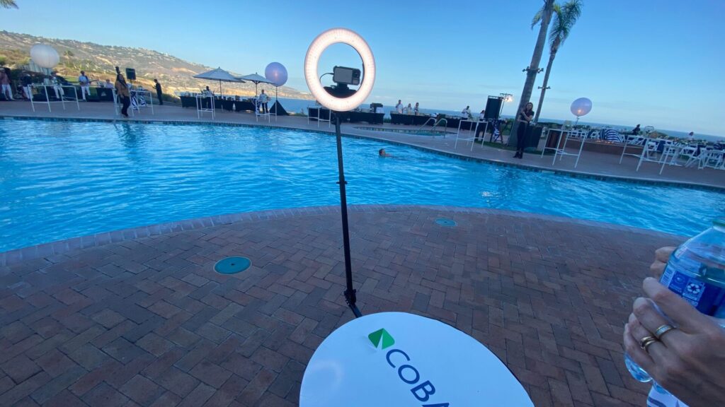 A branded 360 photo booth beside the pool overlooking the ocean at Terranea Resort, Rancho Palos Verdes