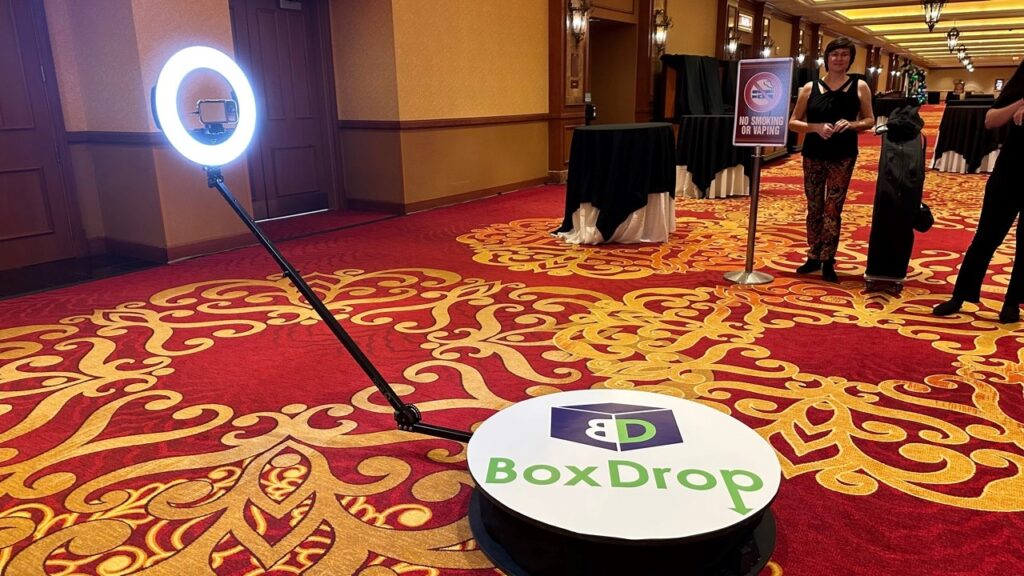360 video booth platform and ring light camera set up in a hotel ballroom