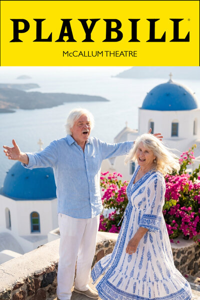 AI photo experience as a Playbill cover for Mamma Mia! at McCallum Theatre: a guest couple sing with open arms on a Santorini terrace framed by blue domes and bougainvillea.
