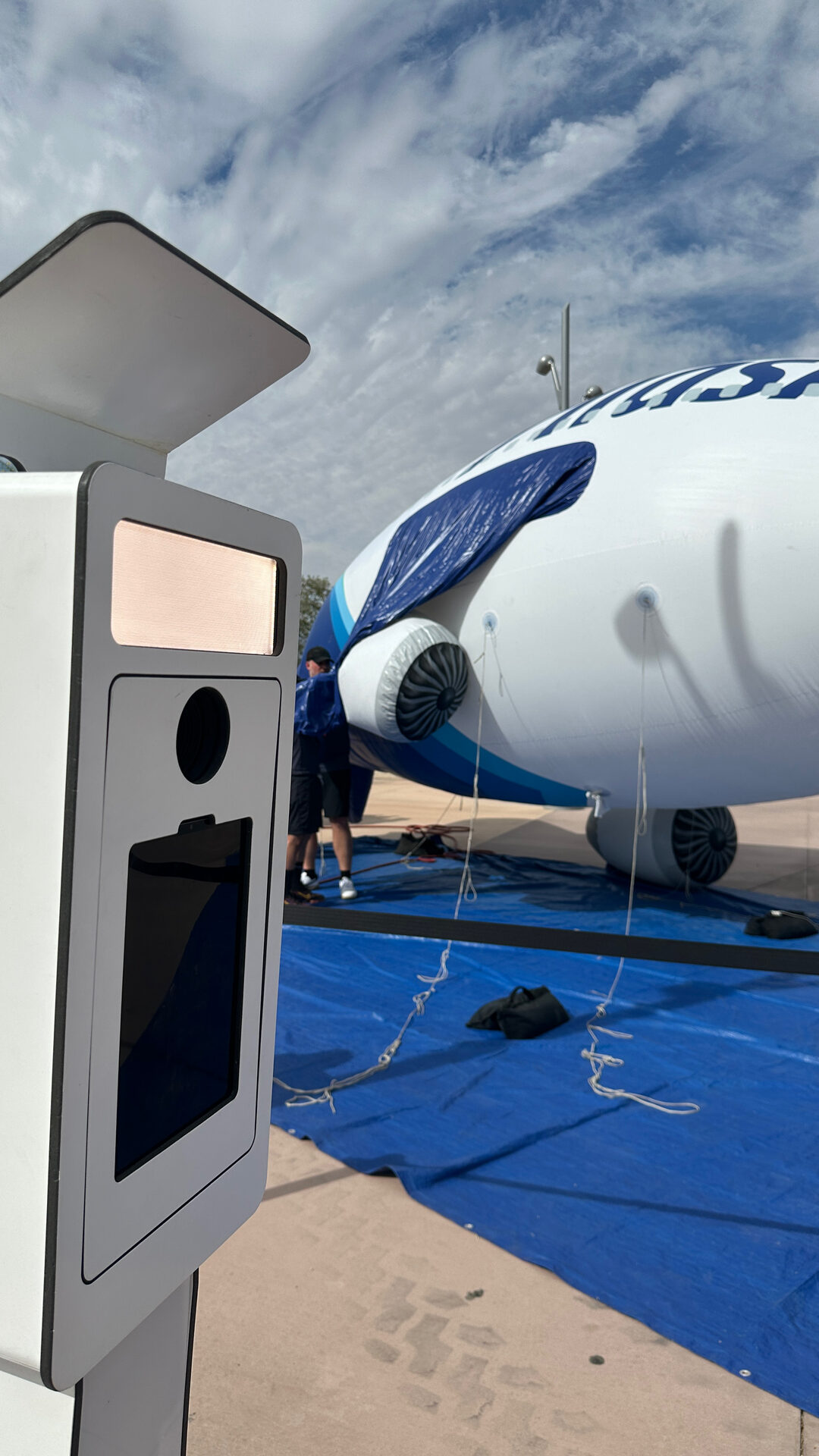 Photo booth positioned next to the Alaska Airlines plane installation