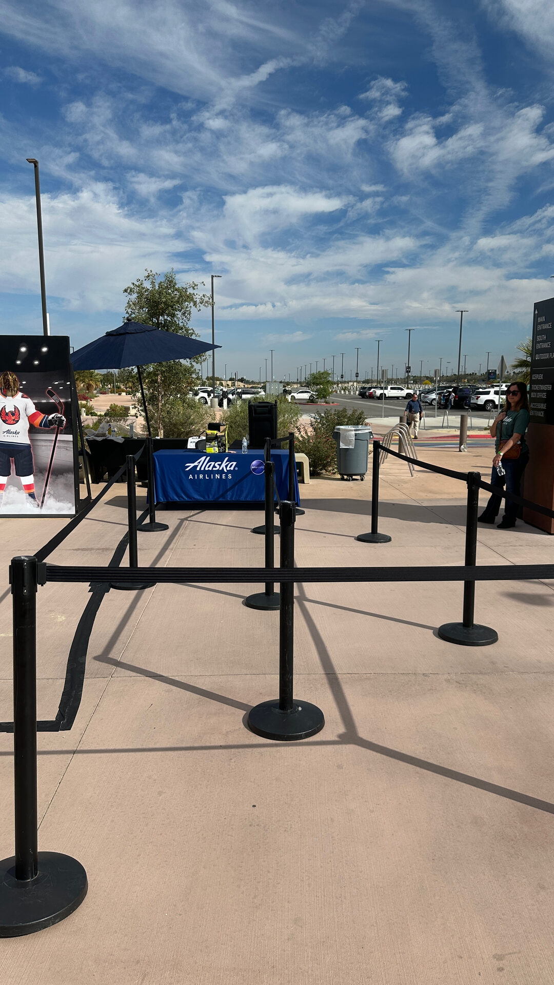 Row of photo booths behind black stanchions ready for guests