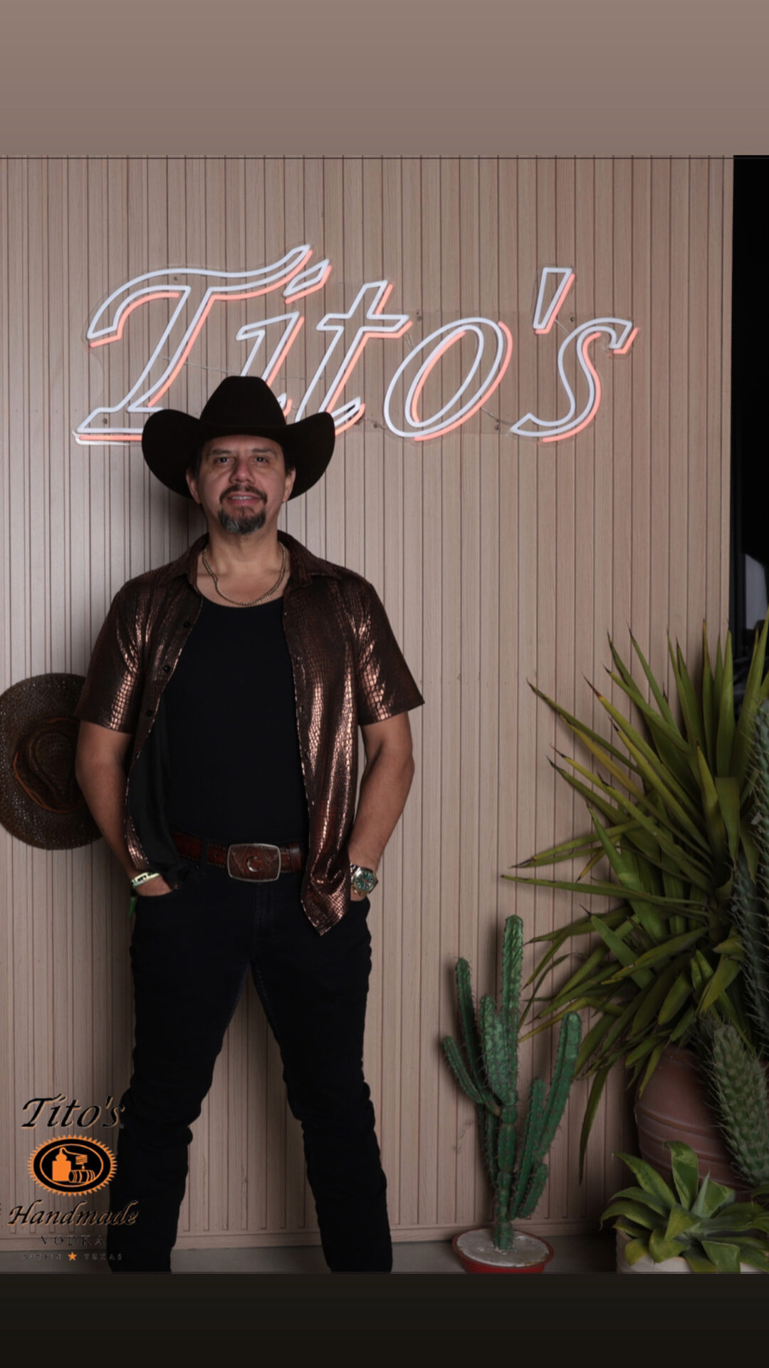 Guest in black western dress against the Tito’s backdrop