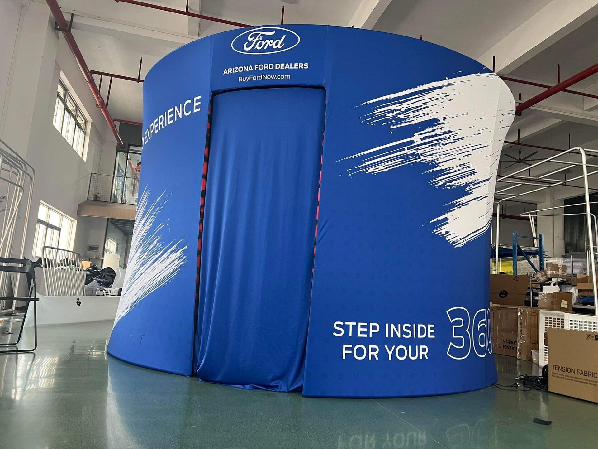A fully branded Ford 360 photo experience enclosure at a corporate activation