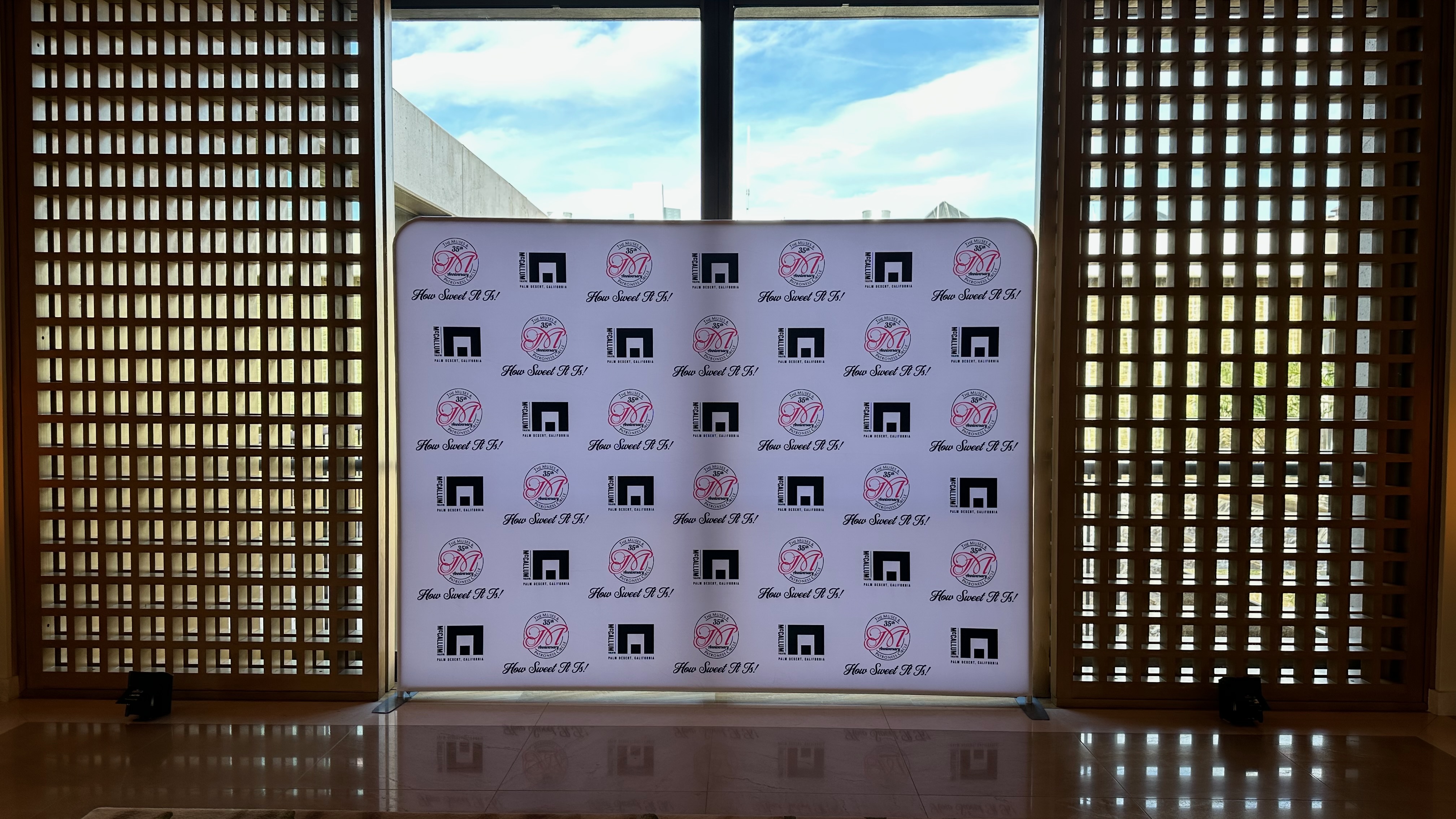 Backlit McCallum Theatre gala logo wall