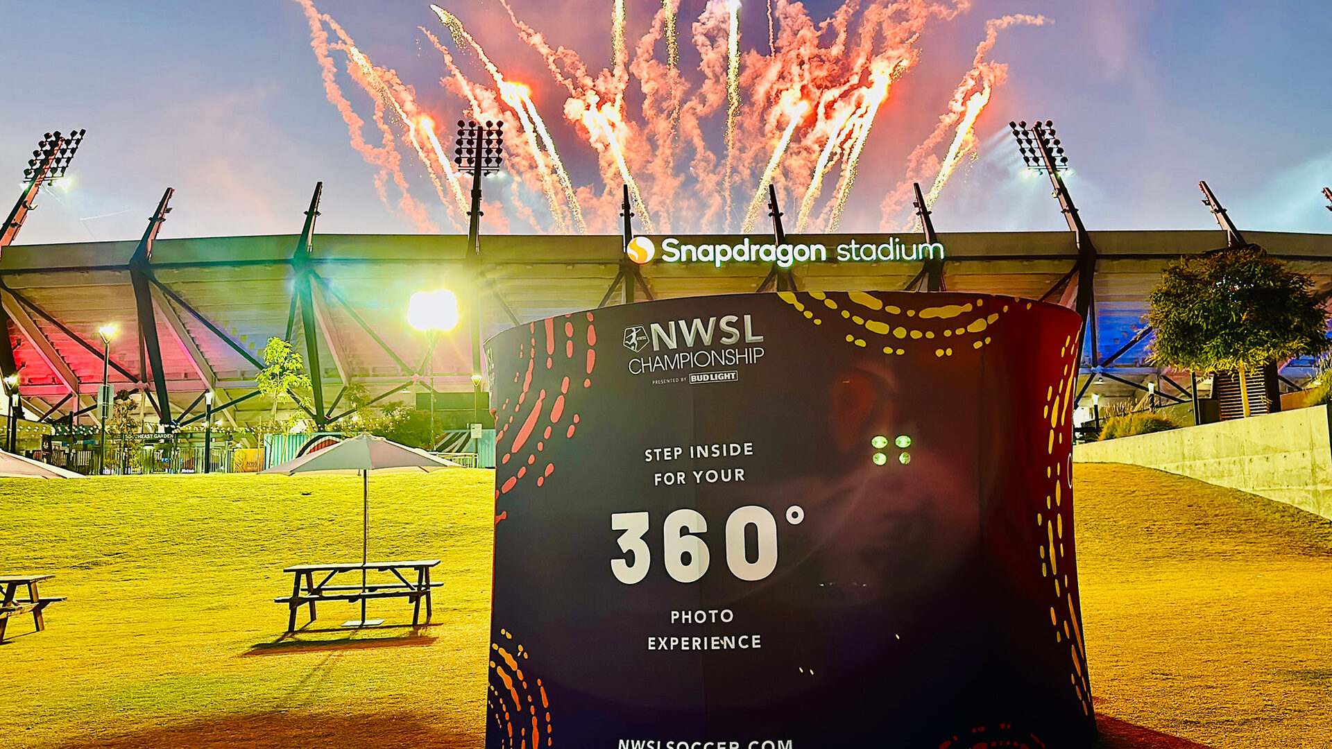 The NWSL Championship 360 booth outside Snapdragon Stadium as the fireworks go up
