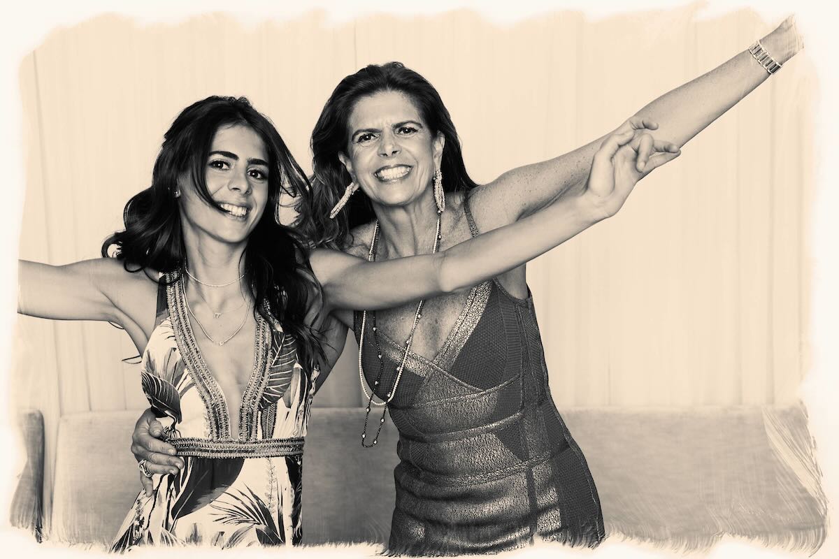 Sepia two women glam arms open