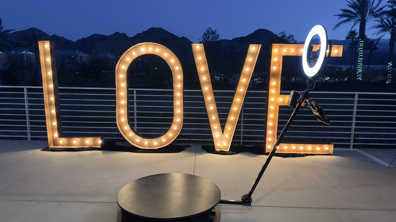 LOVE marquee at dusk with 360 photo booth