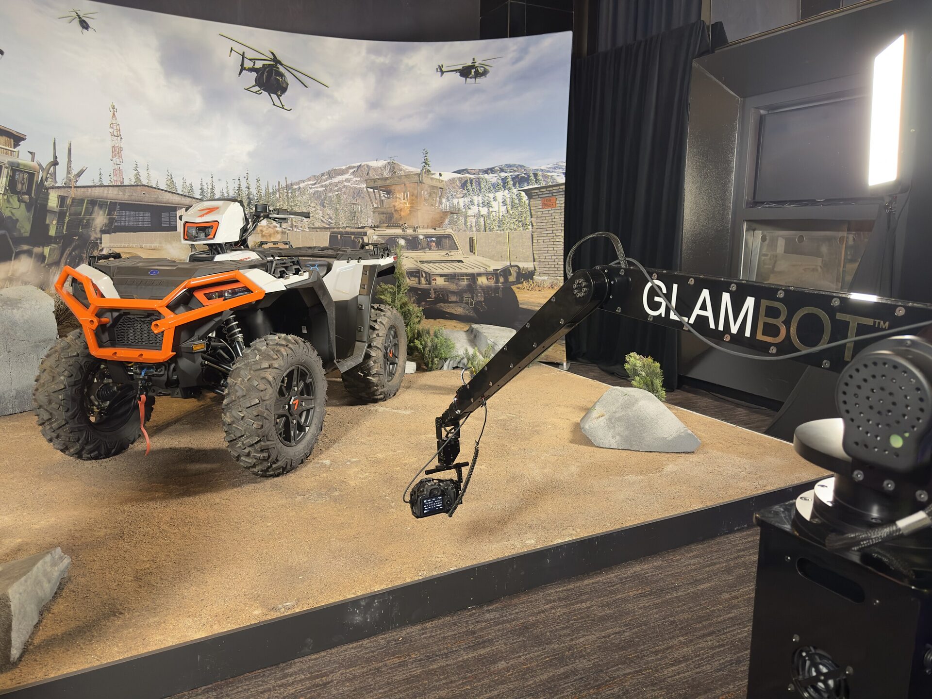 The GlamBot camera arm on a Call of Duty set with an ATV and a warzone backdrop at W Las Vegas
