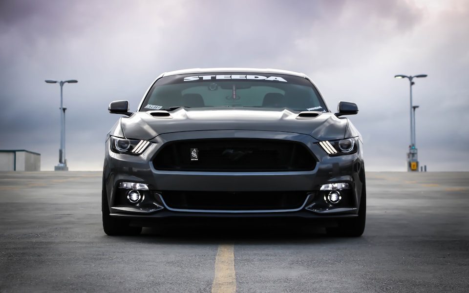 Sport coupe on a dramatic open road