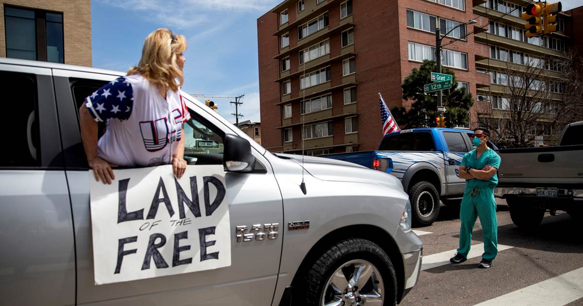 Health care workers took a stand against protesters opposing the coronavirus lockdown in Colorado