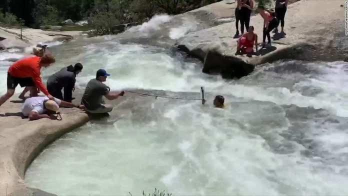 A hiker trapped in a whirlpool was rescued by an off-duty officer using a cord from his backpack