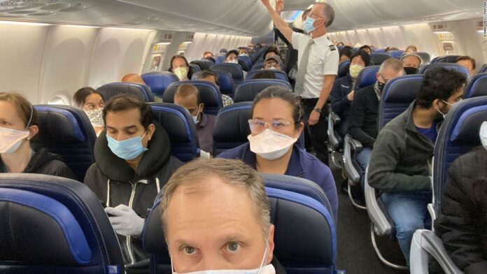United Airlines said it would try to keep middle seats empty. This photo shows a nearly full flight