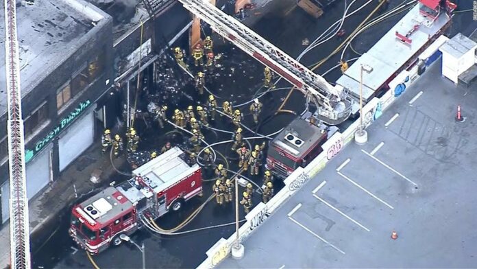 Over 200 firefighters are responding to a blaze in downtown Los Angeles