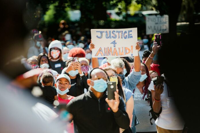 Georgia rally for slain black jogger calls for removing district attorneys