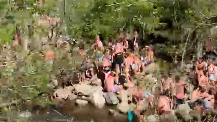 Video shows hundreds of people packed along banks of Boulder Creek