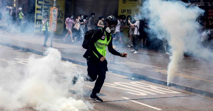 Hong Kong police fire tear gas, water cannons at protest against proposed security law