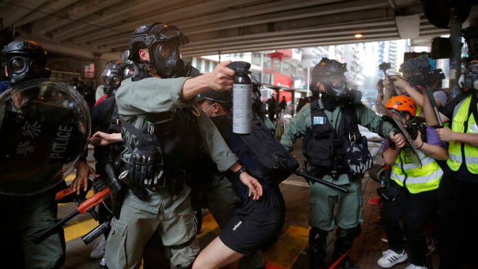 Hong Kong police fire tear gas, water canon as pro-democracy supporters protest new China law