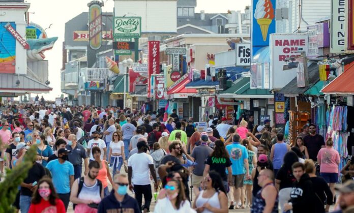 Americans pass pandemic holiday on beaches, in parks as death toll nears 100,000