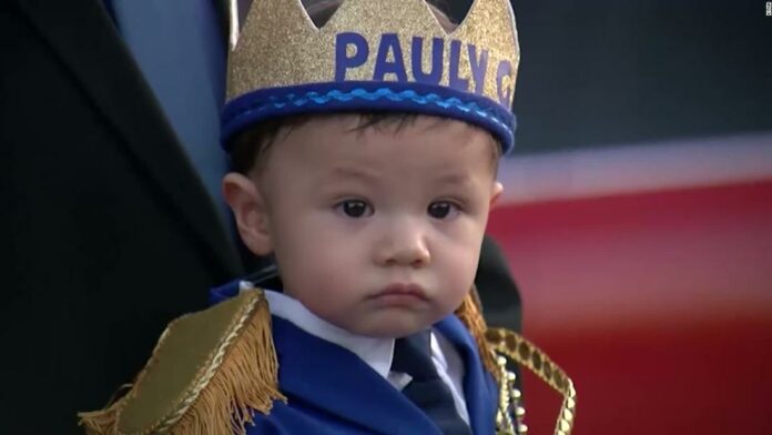 Hundreds took part in a parade celebrating the first birthday of a boy who lost both his parents in the El Paso shooting