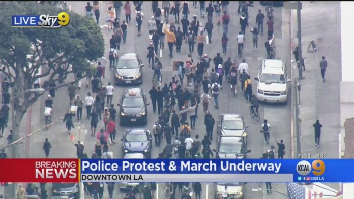 LAPD Officers Clash With Protesters In Downtown Los Angeles