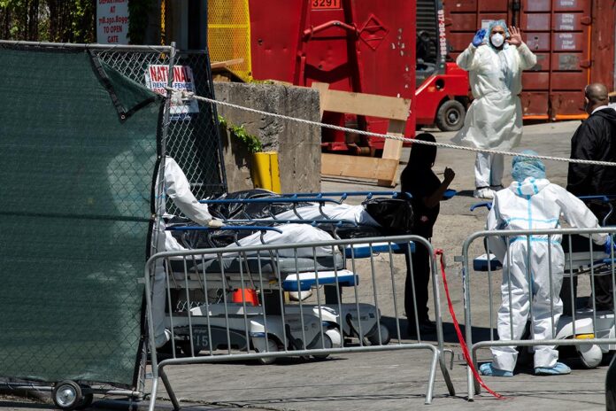 U.S. coronavirus death toll tops 100,000 as Trump pushes to reopen