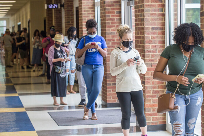 ‘A hot, flaming mess’: Georgia primary beset by chaos, long lines