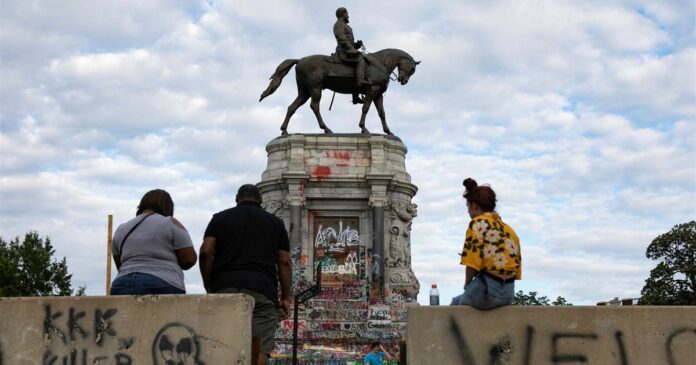 Armed man on roof overlooking Robert E. Lee statue, site of protests in Richmond, taken into custody