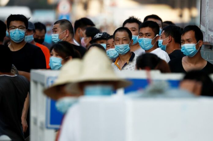 Beijing district in ‘wartime emergency’ after virus spike shuts market
