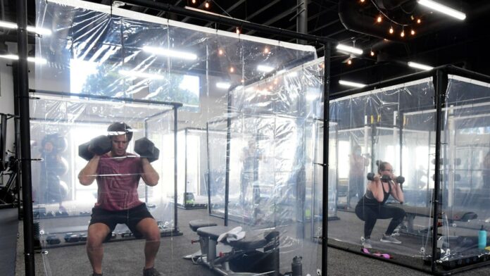 CA Gym Installs Shower Curtain Workout Pods In Return From COVID Closure