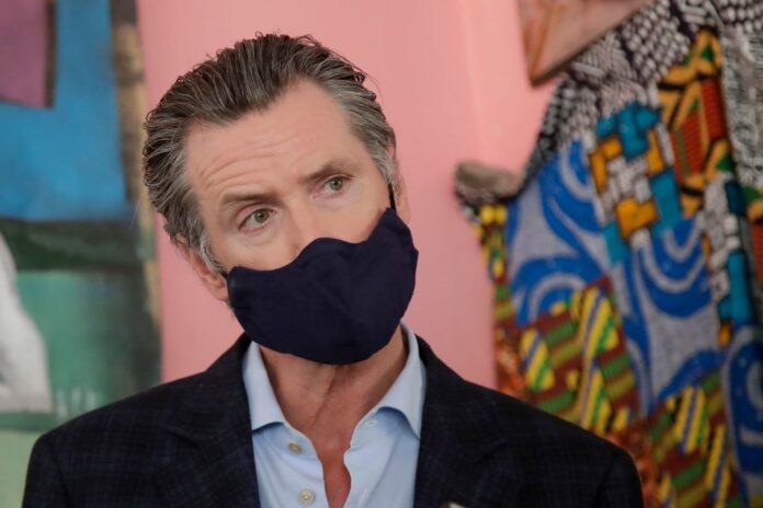 california-governor-gavin-newsom-mandates-coronavirus-masks-in-public.jpg California Governor Gavin Newsom Mandates Coronavirus Masks In Public
