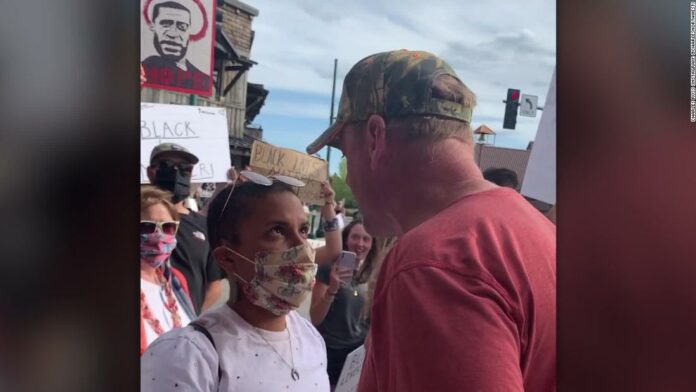 He showed up angry at a Black Lives Matter protest. She showed how to stare him down.