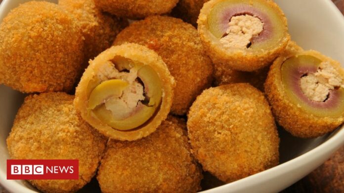 Italian woman prepares olives during brain tumour operation