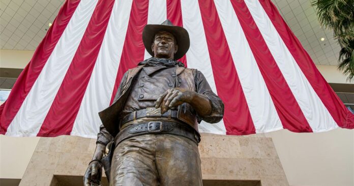 Leaders want John Wayne name, statue gone from Orange County airport